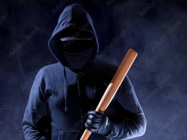 Man armed with bat