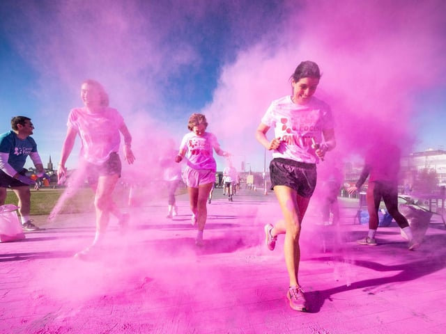 Runners, walkers, and pooches were splashed in pink powder from head to toe for a great cause as Cancer Focus NI’s first Pink Run took place in Londonderry. Picture Steven McAuley/McAuley Multimedia