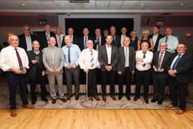 Managing director of Collins Aerospace in Kilkeel, Stuart McKee, is pictured with some of the company’s longest serving employees who left during 2020
