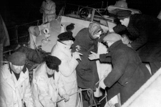 Survivors being landed at Donaghadee, County Down, Northern Ireland, after disaster overtook the British Transport Commission's MV Princess Victoria which sank in a severe gale five miles of the County Down coast with the loss of 130 of the 170 people aboard.