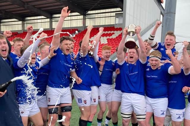 Queen's celebrate their All-Ireland League promotion. Credit: Queen's Rugby