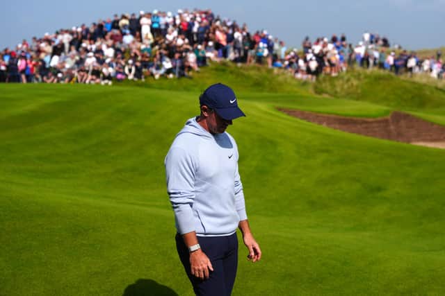 Rory McIlroymakes his way off t he 18th green on day two of the Amgen Irish Open at Trump International Golf Links Ireland in Doonbeg