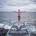 Artem Silchenko of Russia before diving from the 27.5 metre platform during the first rounds of the first stop of the Red Bull Cliff Diving World Series at the Serpent`s Lair, Inis Mor, Ireland. Credit: Romina Amato / Red Bull Content Pool