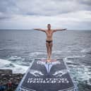 Artem Silchenko of Russia before diving from the 27.5 metre platform during the first rounds of the first stop of the Red Bull Cliff Diving World Series at the Serpent`s Lair, Inis Mor, Ireland. Credit: Romina Amato / Red Bull Content Pool