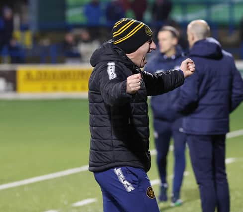 Carrick Rangers manager Stuart King celebrates his side win at the Coleraine Showgrounds