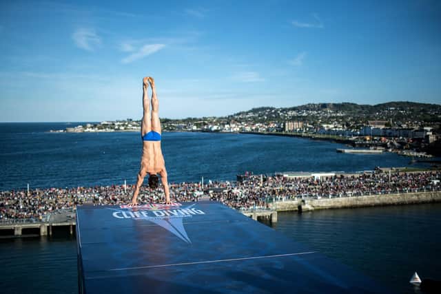 Constantin Popovici of Romania dives from the 27 metre platform at Dun Laoghaire Harbour during the final competition day of the second stop of the Red Bull Cliff Diving World Series. Credit: Romina Amato / Red Bull Content Pool