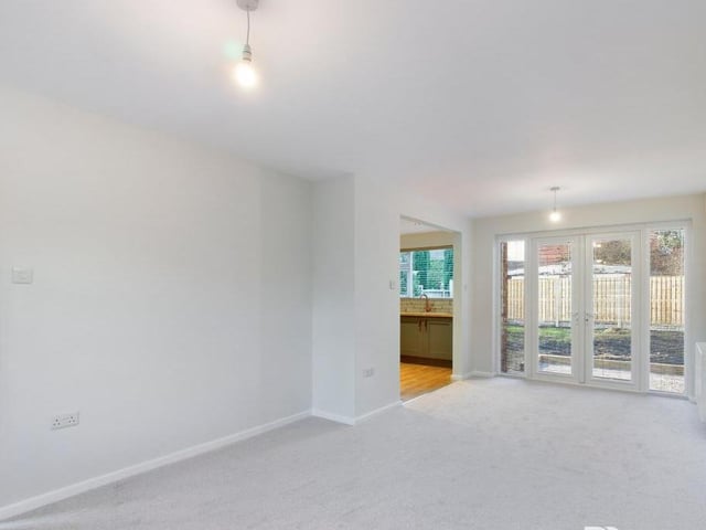 The lounge/diner features uPVC double-glazed patio doors that give access to the back garden. At the other end of the room is a uPVC double-glazed bay window overlooking the front of the property.