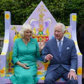 King Charles III and Queen Camilla meet pupils from Belfast's Blythefield Primary School who have taken part in Historic Royal Palaces' competition to design Coronation benches at Hillsborough Castle, Co Down
