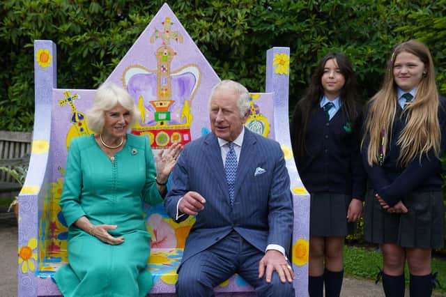 King Charles III and Queen Camilla meet pupils from Belfast's Blythefield Primary School who have taken part in Historic Royal Palaces' competition to design Coronation benches at Hillsborough Castle, Co Down