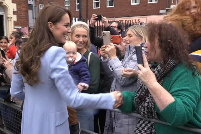 The Princess of Wales shaking hands with a woman who challenged her by suggesting Kate was not in her own country, during an impromptu meet and greet with people in north Belfast, as part of a visit to Northern Ireland. Photo credit: David Young/PA Wire