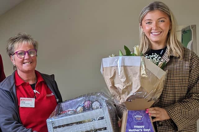 Irene Hunter s presented with her hamper and flowers by Claire Murphy from Henderson Group who thanked her for all she does with charity partner, Cancer Fund for Children, plus many other local charities and organisations.