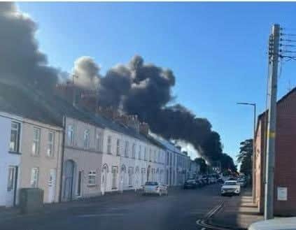 The oil tanker afire as seen from a neighbouring street