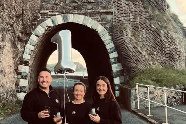 Larne residents Kerrie McKay, Graham Boyd and Karen Fergie innovators of Black Arch Gin celebrate first year in business