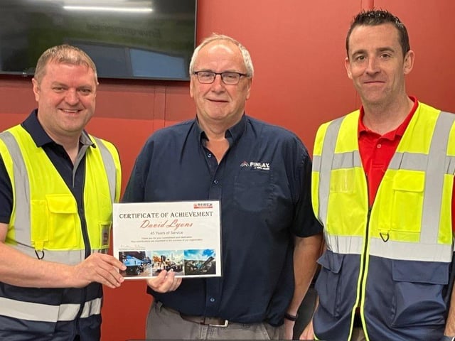 David Lyons receiving his 45 years of service award from Matt Dickson, GM of Terex Omagh and Kieran McCrossan, operations director