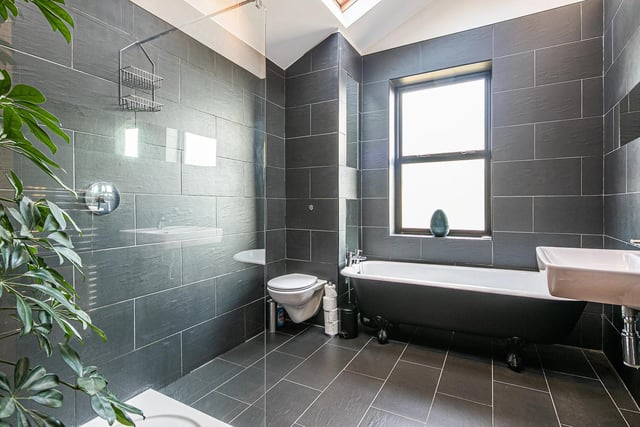 With a freestanding bath, walk-in shower and contemporary tiled finish, this bathroom is a terrific space.