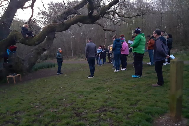 A dawn service under an oak tree at 615am at Belvoir Forest Park on Easter Sunday, April 9 2023. Organised by Ravenhill Presbyterian Church in south Belfast, it was one of the earliest of the such services across Northern Ireland, getting under way 20 minutes before the actual sunrise time of 636am