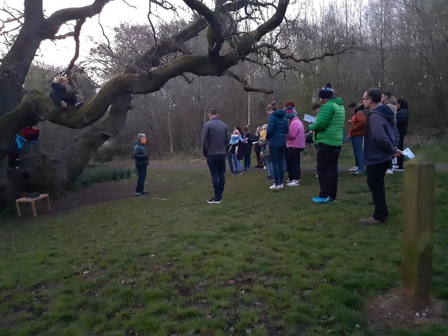 A dawn service under an oak tree at 615am at Belvoir Forest Park on Easter Sunday, April 9 2023. Organised by Ravenhill Presbyterian Church in south Belfast, it was one of the earliest of the such services across Northern Ireland, getting under way 20 minutes before the actual sunrise time of 636am