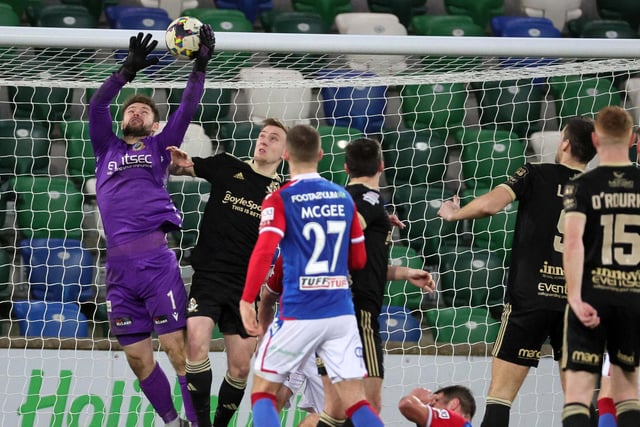 Linfield's Chris Johns kept an 11th clean sheet of the season on Saturday as David Healy's side defeated Crusaders at Windsor Park. He made four saves, including three from inside the box, to help the leaders maintain a four-point advantage.