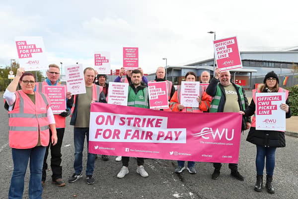 Postal workers from Mallusk sorting office in Newtownabbey in one of nineteen planned strikes in a long-running dispute over pay and working conditions, on Thursday 13 October.