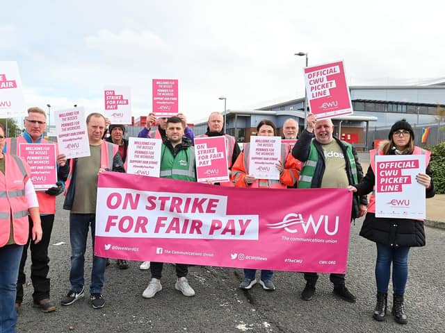 Postal workers from Mallusk sorting office in Newtownabbey in one of nineteen planned strikes in a long-running dispute over pay and working conditions, on Thursday 13 October.