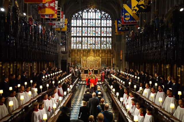 King Charles III and members of the royal family follow behind the coffin of Queen Elizabeth II as it is carried into St George's Chapel in Windsor Castle, Berkshire for her Committal Service. Picture date: Monday September 19, 2022.