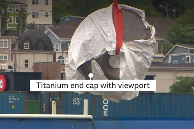 Image of the viewing portal side of the Titan submersible being unloaded in Canada, from annotated footage broadcast by the BBC