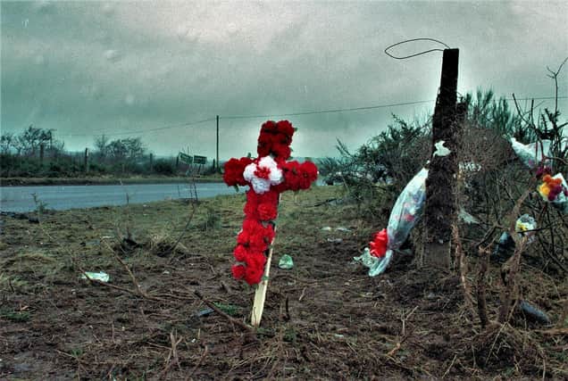 Flowers at the scene of the IRA bombing at Teebane crossroads, between Omagh and Cookstown, in 1992.  A roadside bomb destroyed a van carrying 14 construction workers who had been repairing a British Army base in Omagh. Eight of the men were killed and the rest were wounded