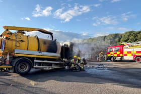 Emergency services attending to a vehicle on fire at a Department of Infrastructure depot near the Sandyknowes roundabout outside Belfast