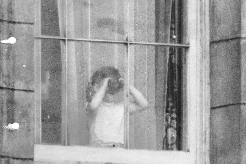 File photo dated 01/06/53 of Prince Charles using binoculars to view the Coronation scene from a window at Buckingham Palace. Issue date: Wednesday April 26, 2023. PA Photo. See PA story ROYAL Coronation King. Photo credit should read: PA/PA Wire
