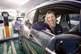 Jenna White, management accountant at Catalyst utilising the new EV charger on her electric car at Catalyst’s Belfast site
