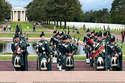 Campbell College Bugles, Pipes and Drums playing at the American Cemetery at Colleville Omaha Beach