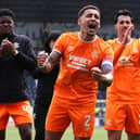 Rangers' James Tavernier (centre) celebrates with fans and team-mates. (Photo by Andrew Milligan/PA Wire)