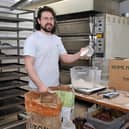 One entrepreneur who benefitted from a Start Up Loan was Tiarnan McKeown when he opened his own business in County Down. Tiarnan weights out the ingredients for his next batch of fresh bread at Glume Bakery, Moira
