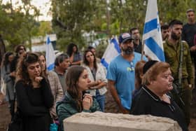 Mourners gather during the funeral of Israeli reserve soldier master sergeant Raz Abulafia in the village of Rishpon, Israel, yesterday. Abulafia, 27, was killed during a military ground operation in the Gaza Strip. Despite seemingly endless conflict in the Middle East, the language of hope and peace must never be expunged, writes Ian Ellis