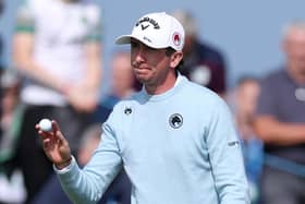 Northern Ireland's Tom McKibbin acknowledges the crowd on the 18th green on day two of the Amgen Irish Open at Trump International Golf Links in Doonbeg. (Photo by Warren Little/Getty Images)