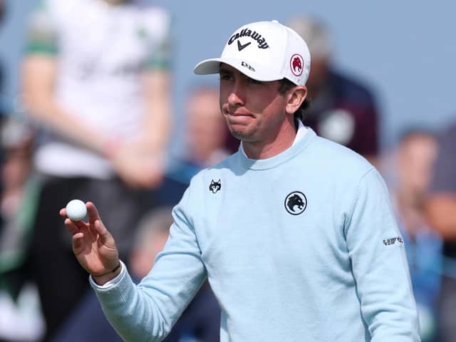Northern Ireland's Tom McKibbin acknowledges the crowd on the 18th green on day two of the Amgen Irish Open at Trump International Golf Links in Doonbeg. (Photo by Warren Little/Getty Images)