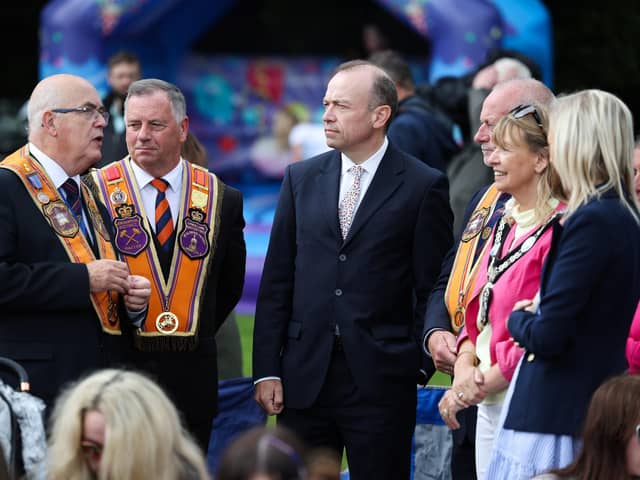 Press Eye - Belfast -  Northern Ireland - 12th July 2023 - Chris Heaton-Harris, Secretary of State for Northern Ireland along with Carla Lockhart MP and Margaret Tinsley, Mayor of Armagh, Banbridge Craigavon Borough Council watch the parade at Brownlow House with Orange Order officers at the County Armagh Twelfth Demonstration making itÕs way through Lurgan town centre to Brownlow House.Eleven District Lodges were on parade, with a total of 150 Private Lodges and almost 5,000 orangemen.In addition, ladies from the Association of Loyal Orangewomen of Ireland took part, along with a number of Junior Boys and Junior Girls Lodges.The Co.  Almost 70 bands will accompany the lodges and some of the finest pipe, accordion, silver and flute Bands in the country will be on parade.Photo by Kelvin Boyes  / Press Eye :Lurgan 12th