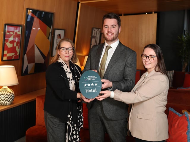 Tourism NI awarding a Belfast city centre hotel a four-star accommodation grade. Pictured is Alison Leslie, quality assurance manager at Tourism Northern Ireland with Ruairi McLaughlin, general manager at voco Belfast and Danielle McGinley, director of Sales & Marketing at voco Belfast