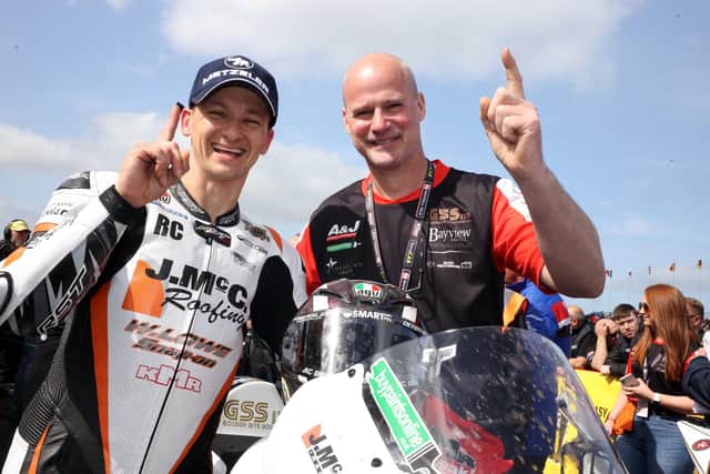 Ryan Farquhar pictured with racer Richard Cooper at the North West 200 last year.