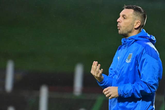 Ballymena United manager Jim Ervin was pleased to see his side leave the Newry Showgrounds with a point following Lewis Tennant's red card
