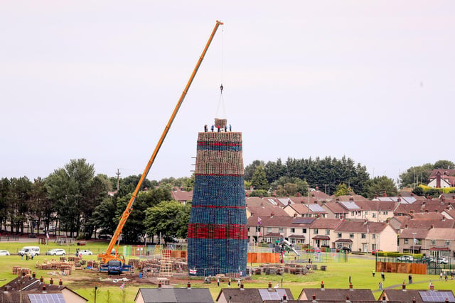 Press Eye - Belfast - Northern Ireland - 9th July 2022 Bonfire builders use a crane at the Craigyhill Bonfire in Larne, Co. Antrim.