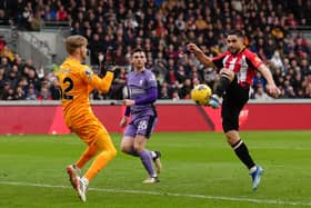 Brentford's Neal Maupay tries to beat Liverpool goalkeeper Caoimhin Kelleher during the Premier League match at the Gtech Community Stadium, London. (Photo by John Walton/PA Wire)