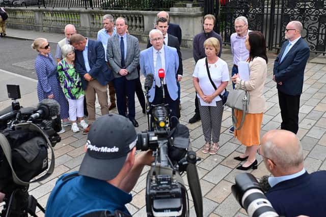 The Hooded men speak to the media in Belfast on Tuesday. Pic Colm Lenaghan/Pacemaker
