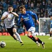 Rangers' Robbie Fraser and Dundee's Finlay Robertson in action during a cinch Premiership match at Ibrox