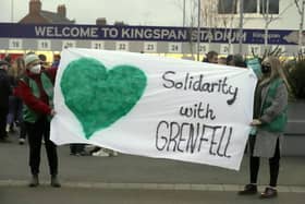 Grenfell campaigners protest at an Ulster match in January 2022