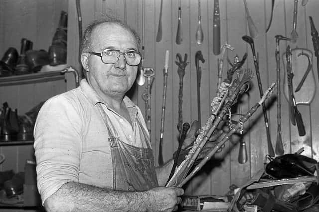 Belfast shoemaker Pat McKernan with his collection of shoehorns, some of which bear a resemblance to riding crops, pictured in his shop on Donegall Street at the end of October 1981. Picture: Darryl Armitage/News Letter archives