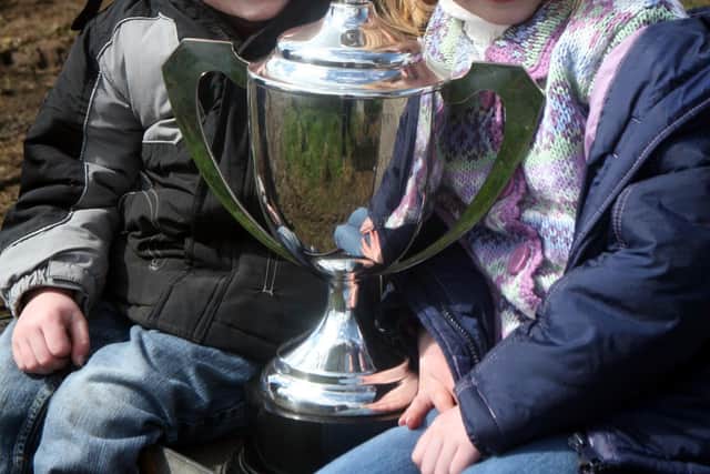 Pictured in April 2008 are Sophie Gaston and Adam Gaston who are with the championship Cameron Cup at the Drummaul ploughing match near Crosskeys. Picture: Farming Life archives/Steven McAuley