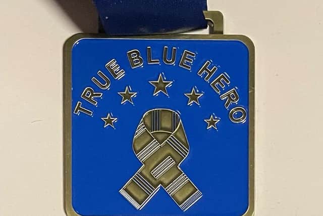 Tim's True Blue Hero medal