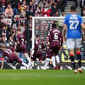 Rangers' Cyriel Dessers (left) scores the opening goal of the Scottish Gas Scottish Cup semi-final win over Hearts at Hampden Park. (Photo by Andrew Milligan/PA Wire)