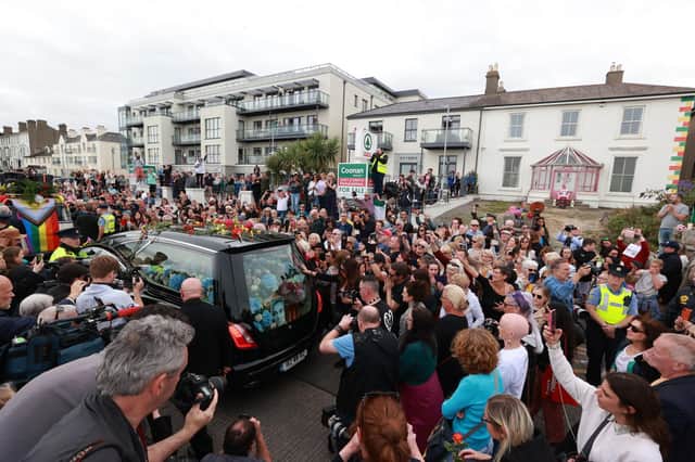 Fans of singer Sinead O'Connor line the streets for a "last goodbye" to the Irish singer as her funeral cortege passes through her former hometown of Bray, Co Wicklow, ahead of a private burial service. Photo: Liam McBurney/PA Wire